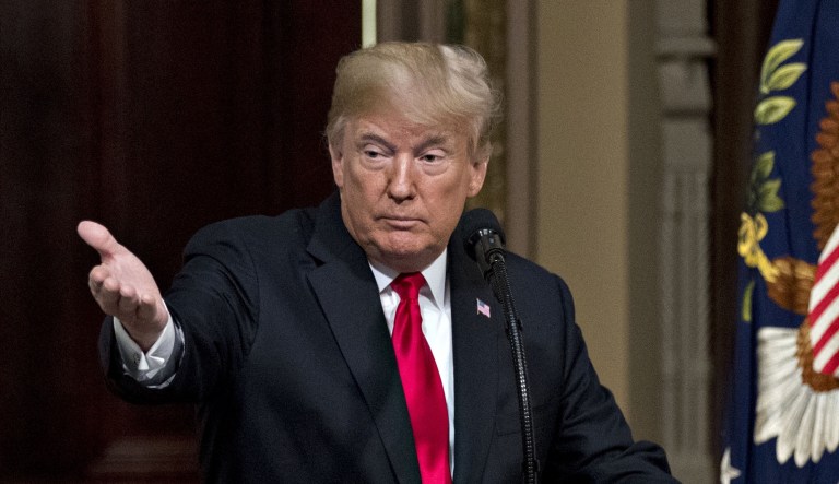 President Trump gestures while speaking during an Interagency Task Force to Monitor and Combat Trafficking in Persons annual meeting in the Indian Treaty Room of the Eisenhower Executive Office Building in Washington, D.C., on Thursday, Oct. 11, 2018.