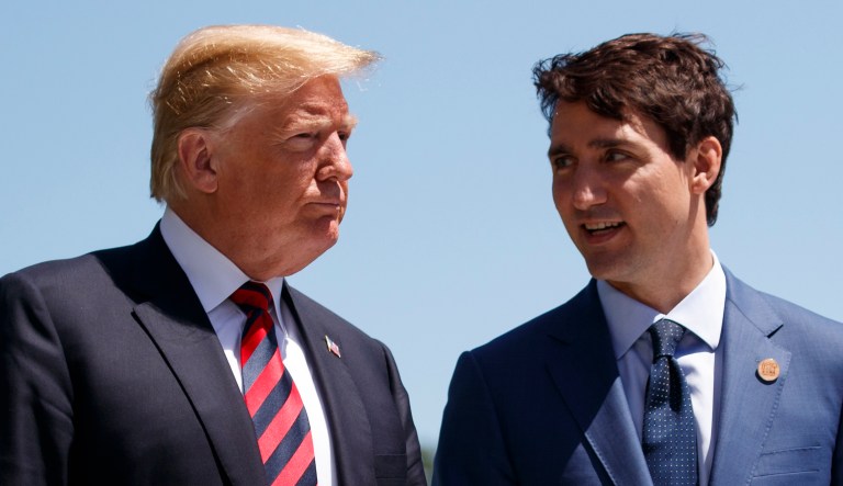 President Donald Trump talks with Canadian Prime Minister Justin Trudeau during a G-7 Summit welcome ceremony, Friday, June 8, 2018, in Charlevoix, Canada.