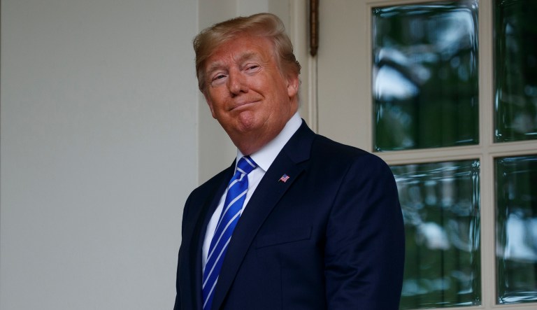 President Donald Trump walks into the Oval Office of the White House for a meeting with Mongolian President Khaltmaa Battulga, Wednesday, July 31, 2019, in Washington.