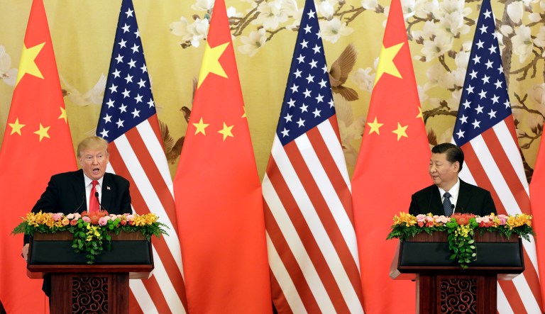 U.S. President Donald Trump, left, speaks as Xi Jinping, China's president, looks on during a news conference at the Great Hall of the People in Beijing, China, on Thursday, Nov. 9, 2017. TrumpÂ said China is taking advantage of American workers and American companies with unfair trade practices, but he blamed his predecessors in the White House rather than China for allowing the massive U.S. trade deficit to grow.