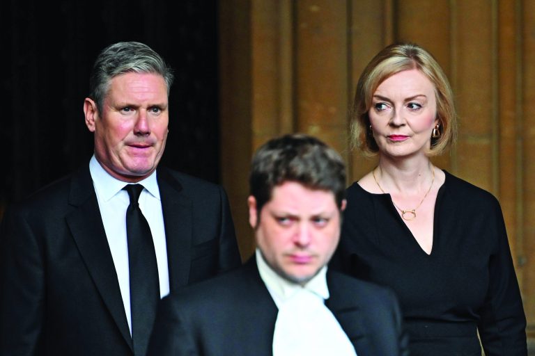 Labour Party leader Sir Keir Starmer, left, and UK Prime Minister Liz Truss, right, leave the Palace of Westminster in London, Sept. 12, 2022.