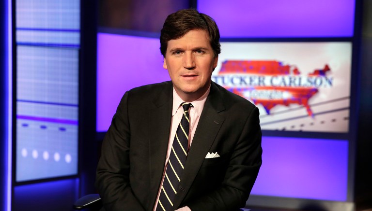 Tucker Carlson, host of "Tucker Carlson Tonight," poses for photos in a Fox News Channel studio, in New York, Thursday, March 2, 2017.