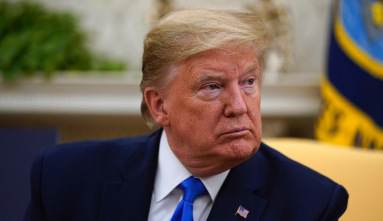 President Donald Trump speaks during a meeting with Gov. Kim Reynolds, R-Iowa, in the Oval Office of the White House, Wednesday, May 6, 2020, in Washington.