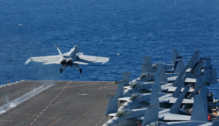 In this May 3, 2019 photo released by the U.S. Navy, An F/A-18E Super Hornet from VFA 25 launches from the flight deck of the Nimitz-class aircraft carrier USS Abraham Lincoln. 
