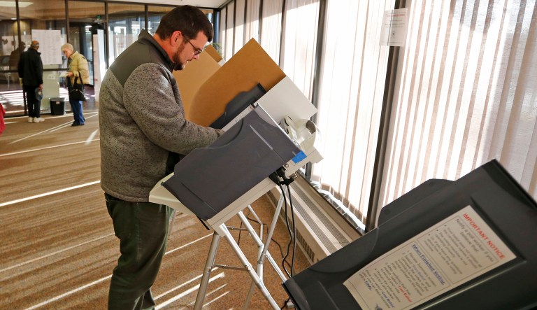 Eric McGill votes at polling place Tuesday, Nov. 7, 2017, in Salt Lake City. The Republican mayor of the Mormon stronghold of Provo is expected to sail to victory in a special election Tuesday to replace former U.S. Rep. Jason Chaffetz in a congressional district where Republicans outnumber Democrats 5-to-1.
