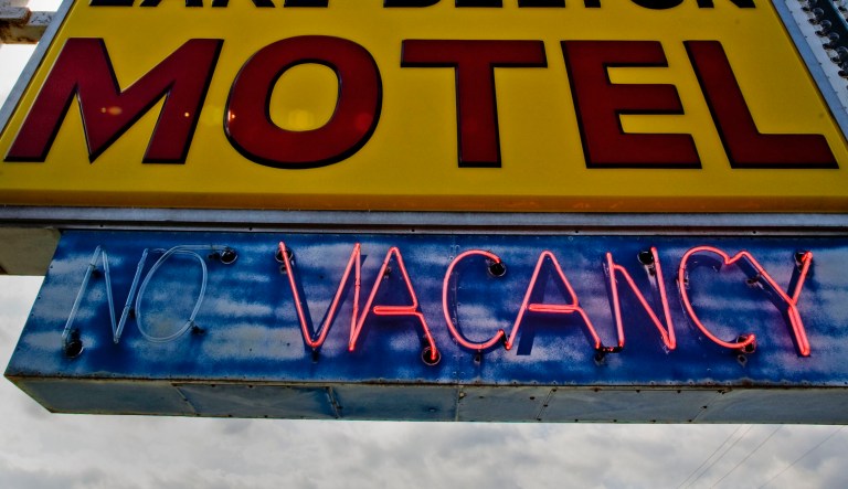 **ADVANCE FOR USE MONDAY JULY 21**A vacancy sign is seen at the Lake Delton Hotel Tuesday, July 15, 2008, in Lake Delton, Wis. In a bizarre disaster-in-reverse, torrential rains in June blew a giant hole in Lake Delton's shoreline. The lake drained away, taking vacation homes with it and leaving behind a muddy moonscape of stumps and puddles.