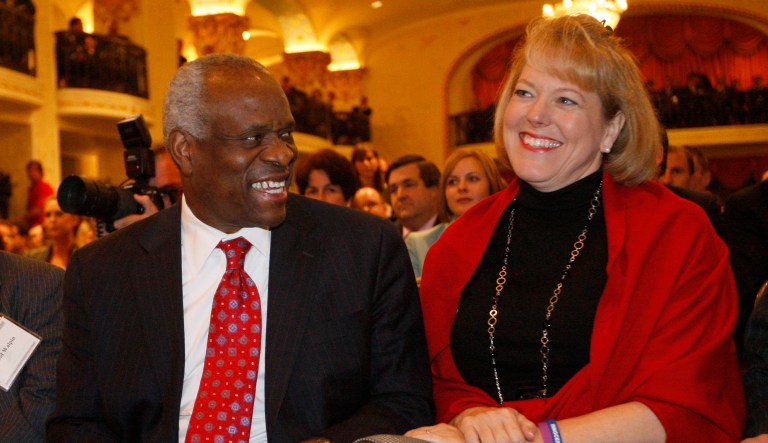 FILE - In this Nov. 15, 2007 file photo, Supreme Court Justice Clarence Thomas sits with his wife Virginia Thomas in Washington. With their Ivy League pedigrees and East Coast addresses, Supreme Court justices often are rightly described as unrepresentative of the nation. But in one area, the justices look a lot like the rest of America. Members of the court have first-hand experience with divorce and adoption, as well as making it alone without ever getting married. Just five of the nine justices have been married once and have had biological children with their spouses.