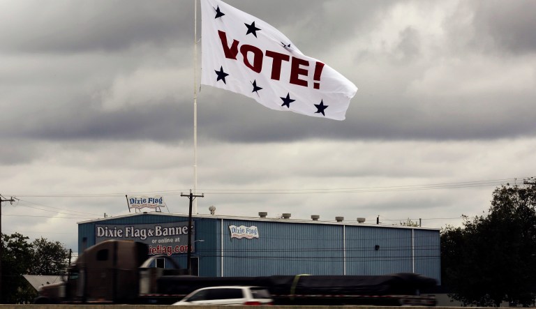 FILE - In this Nov. 8, 2016, file photo, a huge "Vote!" flag waves above Interstate 35 as motorists pass, in San Antonio. Texas voters are being asked to approve or reject seven proposed amendments to the state constitution in upcoming elections. They deal with everything from property tax exemptions to looser home equity loan rules to sports raffles and savings accounts that offer prizes for opening them. The Legislature had proposed 673 constitutional amendments, with 491 approved by voters, 179 defeated and three failing to make the ballot for "reasons that are historically obscure," according to the Texas Legislative Council.
