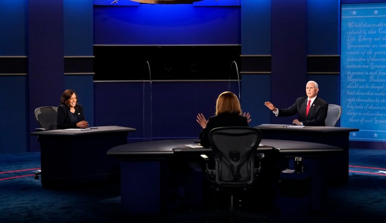 Moderator Susan Page, Washington Bureau Chief for USA Today, explains the rules to Vice President Mike Pence and Democratic vice presidential candidate Sen. Kamala Harris, D-Calif., during the vice presidential debate Wednesday, Oct. 7, 2020, at Kingsbury Hall on the campus of the University of Utah in Salt Lake City. 