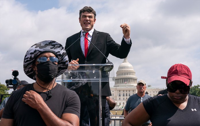 Joe Kent, center, speaks during a "Justice For J6" rally near the U.S. Capitol in Washington, on Sept. 18, 2021.
