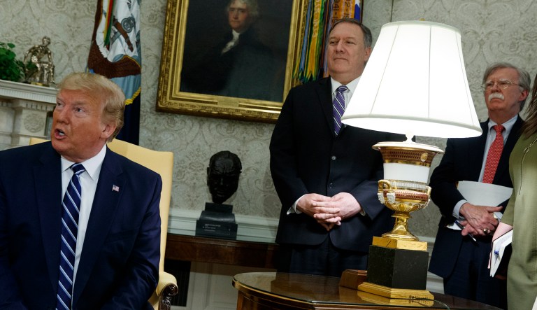Secretary of State Mike Pompeo and National security adviser John Bolton look on as President Donald Trump meets with Canadian Prime Minister Justin Trudeau in the Oval Office of the White House, Thursday, June 20, 2019, in Washington.