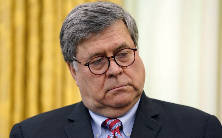 Attorney General William Barr listens as President Donald Trump speaks before signing an executive order aimed at curbing protections for social media giants, in the Oval Office of the White House, Thursday, May 28, 2020, in Washington.
