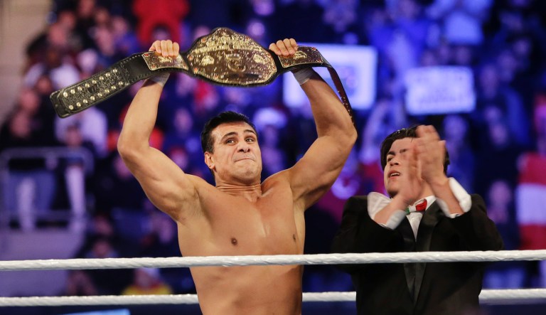 WWE wrestling super star John Cena speaks Chinese in for Chinese reporters during a news conference Sunday, April 7, 2013, in East Rutherford, N.J., ahead of Sunday's WWE Wrestlemania. 