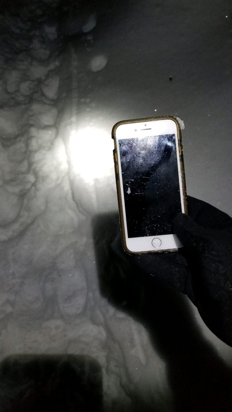 LAUREL HIGHLANDS, Pennsylvania - Photo of Andrea Rodiâs phone buried in the snow around mile marker 47 along the Laurel Highlands Hiking Trail. 