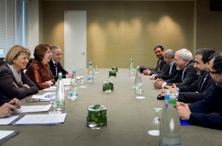 EU foreign policy chief Catherine Ashton, second left, and Iranian Foreign Minister Mohammad Javad Zarif, third right, are pictured during talks over Iran's nuclear program in Geneva on Friday. (AFP POOL/Fabrice Coffrini)