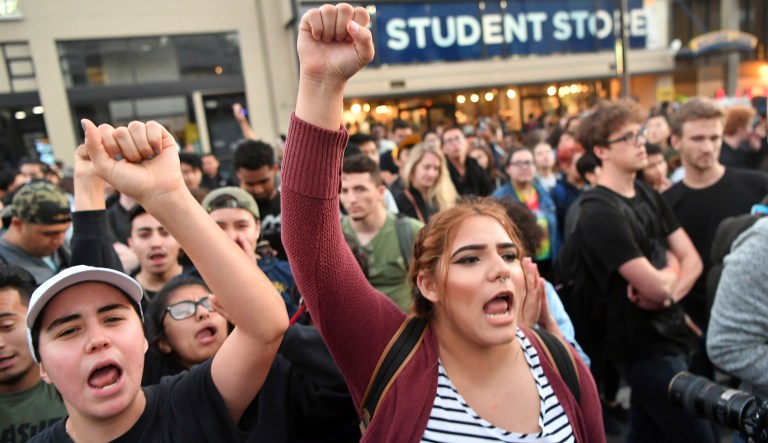 Protesters shout before a speaking engagement by Ben Shapiro on the campus of the University of California Berkeley in Berkeley, Calif., Thursday, Sept. 14, 2017. (AP Photo/Josh Edelson)