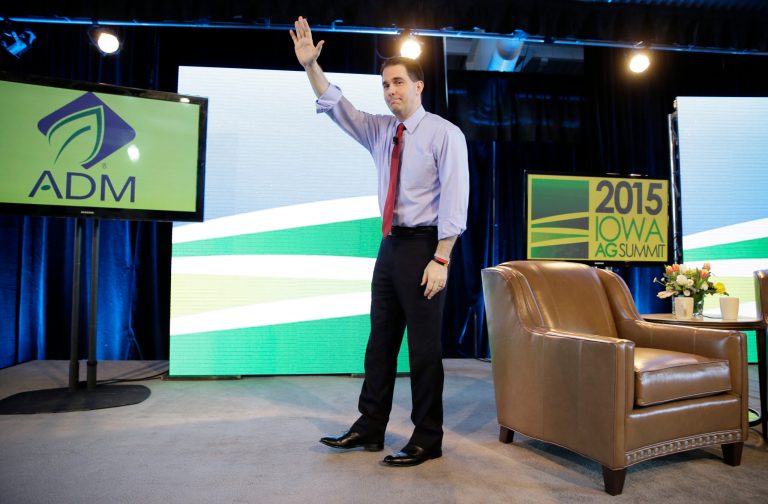 Wisconsin Gov. Scott Walker waves as he walks off stage after speaking at the Iowa Agriculture Summit, Saturday, March 7, 2015, in Des Moines, Iowa. (AP Photo/Charlie Neibergall)