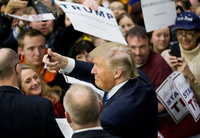 The billionaire's poll numbers are upending the conventional wisdom that winning requires expensive ad buys. (AP Photo/David Goldman)