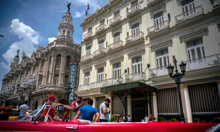 A vintage American car is parked in front of the Inglaterra hotel in Havana, Cuba, Saturday, June 17, 2017. United States President Donald Trump declared he was restoring some travel and economic restrictions on Cuba that were lifted as part of the Obama administration's historic easing.(AP Photo/Ramon Espinosa)