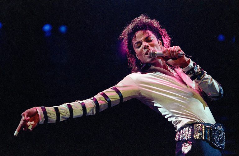   In this Feb. 24, 1988 file photo, Michael Jackson leans, points and sings, dances and struts during the opening performance of his 13-city U.S. tour, in Kansas City. Some key figures who helped manage Michael Jacksonâs career are teaming up to create a musical about the behind-the-scenes making of a superstar that producers call a cross between 
