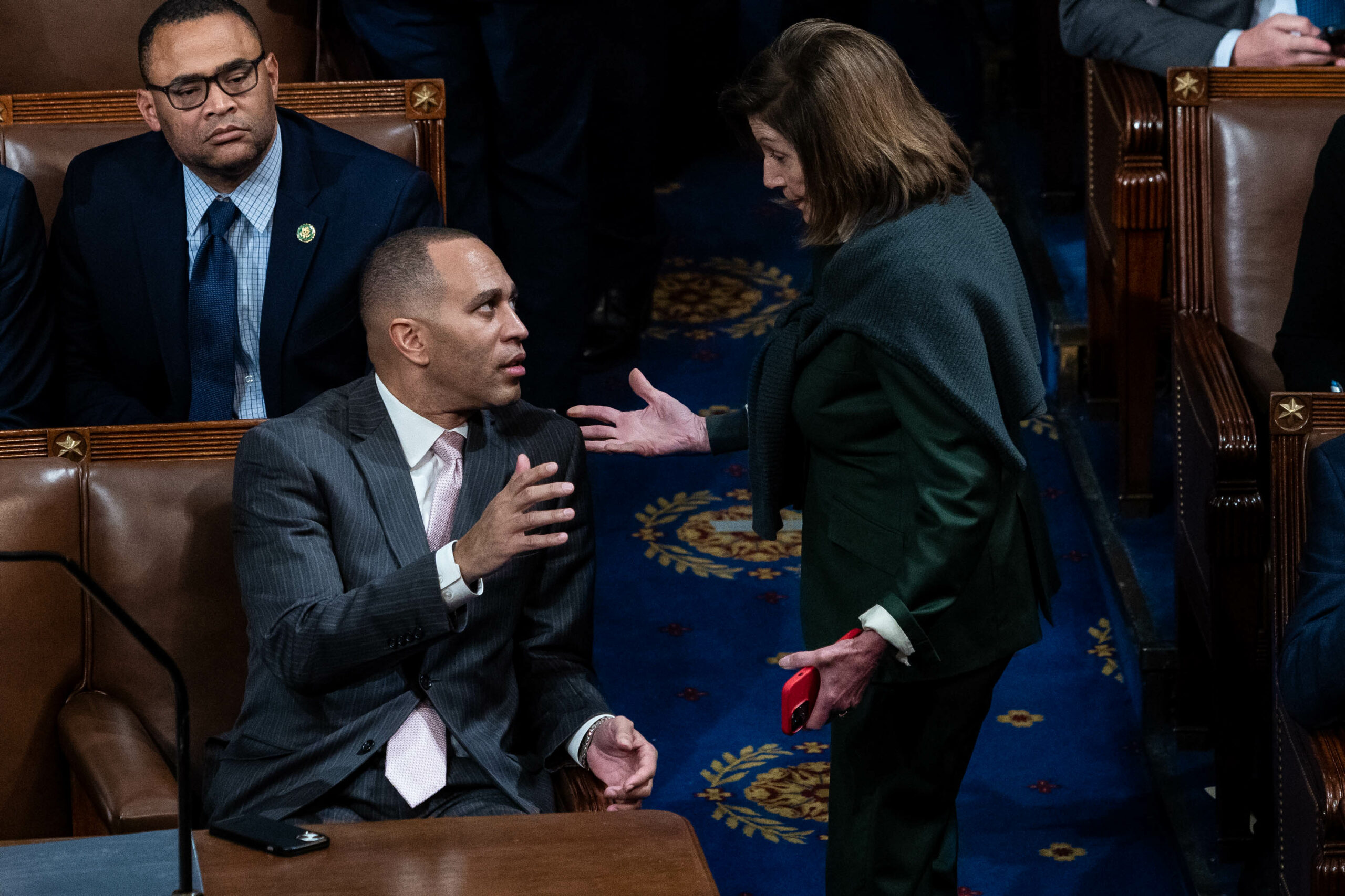 Democratic Leader Hakeem Jeffries speaks with former House Speaker Nancy Pelosi, in the House chamber, on Wednesday, Jan. 4, 2023.