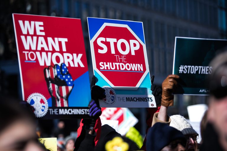 Union members and other federal employees rally to call for an end to the partial government shutdown on Thursday outside the White House. 