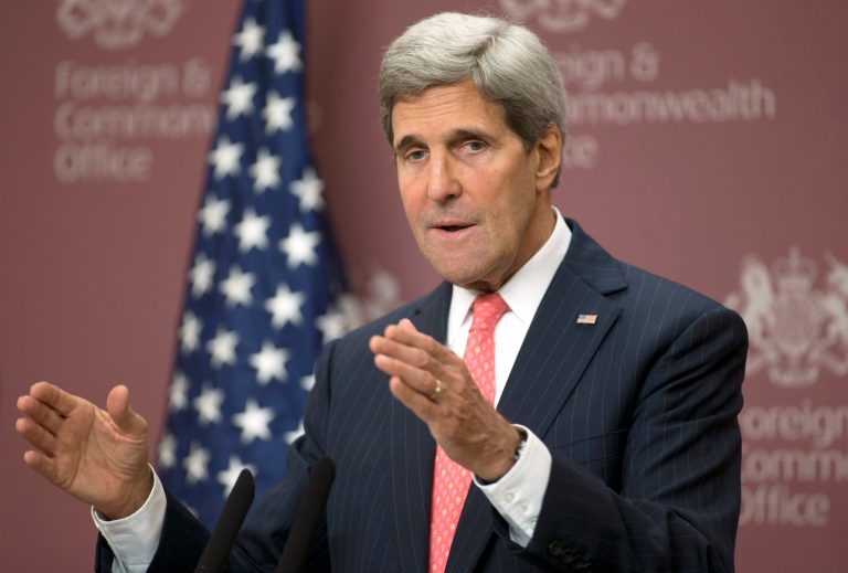 FILE - In this Oct. 22, 2013, file photo, U.S. Secretary of State John Kerry speaking to the media at the British Foreign Office in London. Kerry took part in London 11 friends of Syria meeting, and was responding to questions from the media. Kerry has spent nearly half of his first year as secretary of state jumping on and off airplanes and diving headlong into some of the world's most difficult problems. Kerry has spent nearly half of his first year as secretary of state jumping on and off airplanes and diving headlong into some of the world's most difficult problems. (AP Photo/Alastair Grant, Pool)
