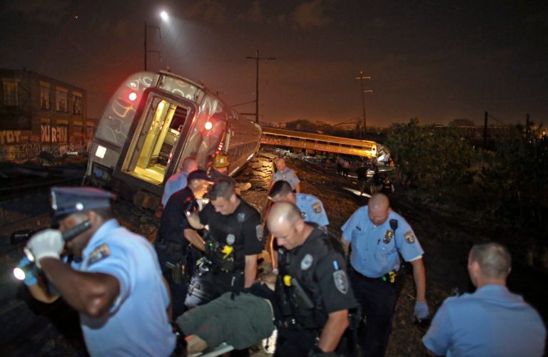 Emergency personnel work the scene of a train wreck, Tuesday, May 12, 2015, in Philadelphia. An Amtrak train headed to New York City derailed and crashed in Philadelphia. (AP Photo/ Joseph Kaczmarek)