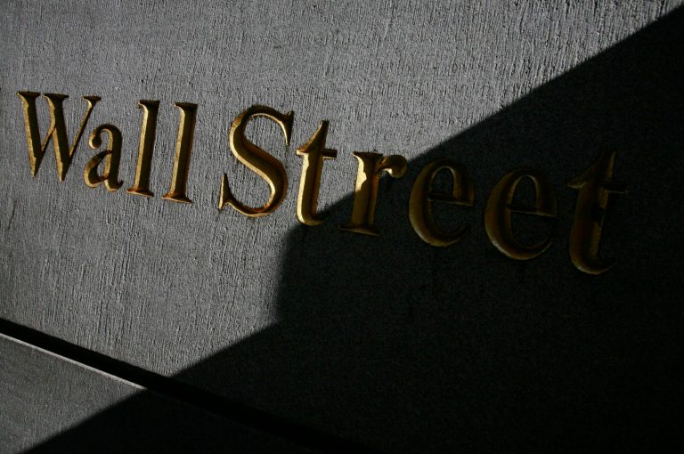 FILE - A sign for Wall Street is shown in this March 8, 2010 file photo near the New York Stock Exchange. Global stocks mostly rose Wednesday, July 23, 2014, bolstered by solid U.S. earnings and home sales as tensions between Russia and the West over Ukraine eased. (AP Photo/Mark Lennihan, File)