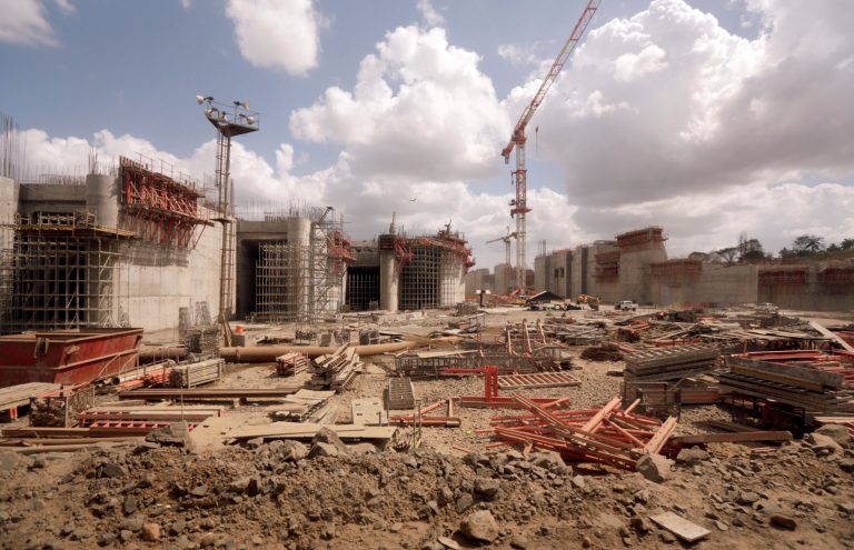 Cranes and machinery lie idle at the construction site of the Panama Canal in Cocoli, Panama City, Wednesday, Feb. 5, 2014. Work on the ambitious Panama Canal expansion project was halted Wednesday after talks broke down on how to settle a dispute over $1.6 billion in cost overruns. Panama Canal Authority Administrator Jorge Quijano told a news conference the stoppage will give authorities time to analyze how to proceed on the project to widen the canal. (AP Photo/Arnulfo Franco)