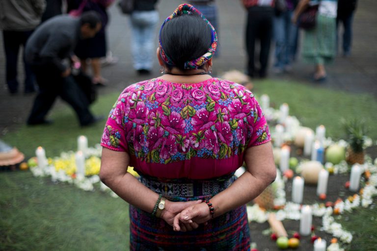 Rigoberta Menchu, a Nobel Peace prize winner, attends a religious Mayan ceremony outside the Supreme Court before the start of a trial connected to the death of her father in Guatemala City, Wednesday, Oct. 1, 2014. Former police chief Pedro Garcia Arredondo is going on trial in connection with the death of Menchu's father, and 36 more people, who died on Jan. 31 in 1980 during an attack by alleged government agents. The attackers burned down the Spanish embassy in Guatemala where Mayan peasants were occupying in protest. (AP Photo/Moises Castillo)