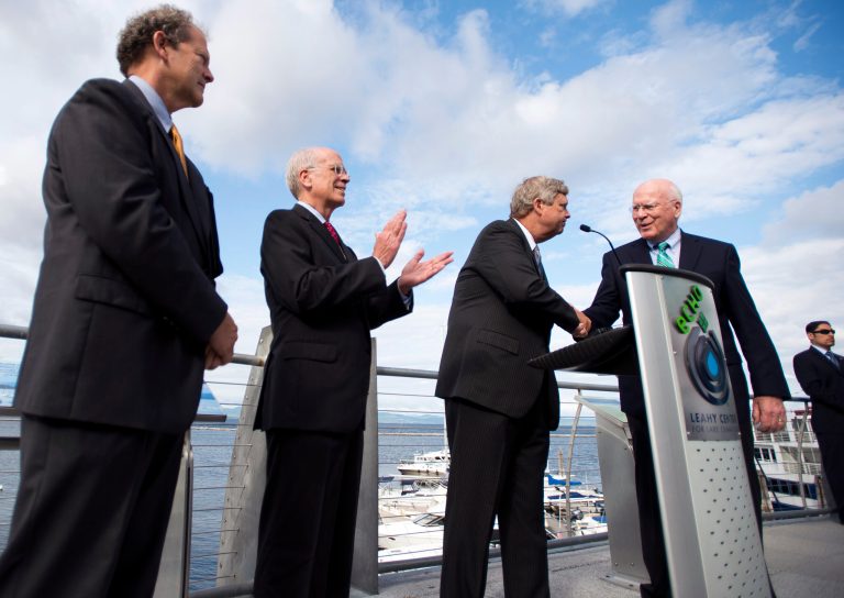 U.S. Secretary of Agriculture Tom Vilsack, second from right, shakes hands with Sen. Patrick Leahy, D-Vt., right, after speaking Thursday, Aug. 28, 2014, at ECHO Lake Aquarium and Science Center in Burlington, Vt. At left is Vermont Agriculture Secretary Chuck Ross, and applauding is Rep. Peter Welch, D-Vt., second from left. Vilsack announced his agency will double the pace of spending on efforts to reduce farm runoff entering Lake Champlain. (AP photo/Burlington Free Press, Ryan Mercer) NO SALES, MAGS OUT, TV OUT, INTERNET OUT, MANDATORY CREDIT
