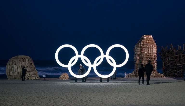 Olympic rings glow next to art installations prior to the 2018 Winter Olympics in Gangneung, South Korea, Sunday, Feb. 4, 2018. Gangneung is the site of the coastal cluster which will host ice hockey, figure skating, speed skating, short track and curling for the 2018 Olympics. (AP Photo/Felipe Dana)