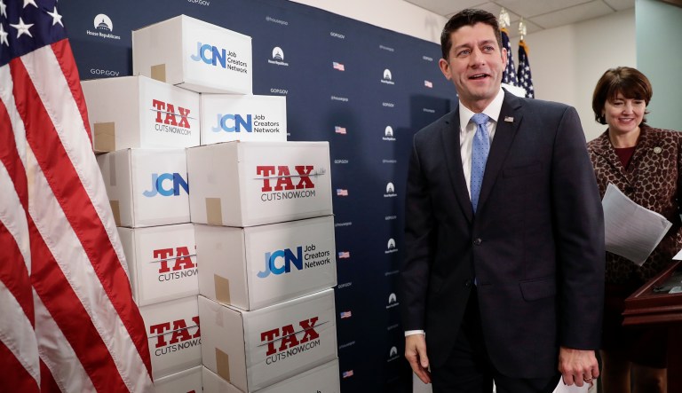 Speaker of the House Paul Ryan, R-Wis., followed at right by Rep. Cathy McMorris Rodgers, R-Wash., walks past boxes of petitions supporting the Republican tax reform bill that is set for a vote later this week as he arrives for a news conference on Capitol Hill in Washington, Tuesday, Nov. 14, 2017. (AP Photo/J. Scott Applewhite)