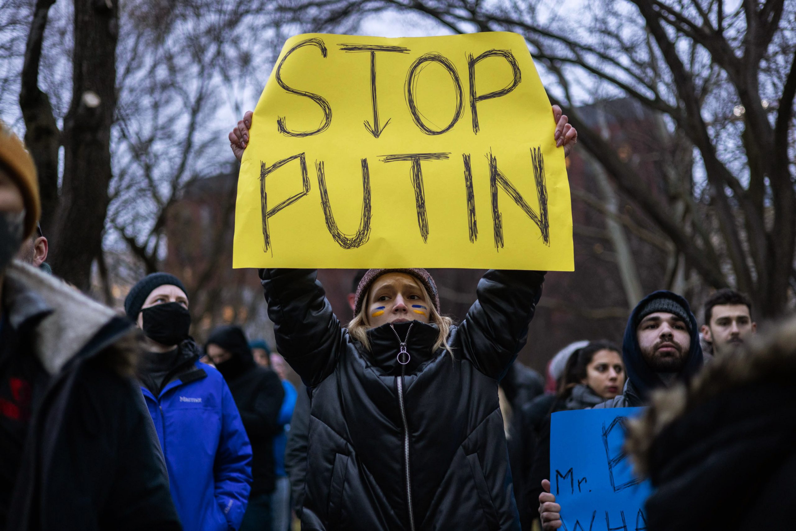 Activists rally against Russia's invasion and war in Ukraine during a protest in Lafayette Park near the White House, Thursday, Feb. 24, 2022, in Washington D.C.