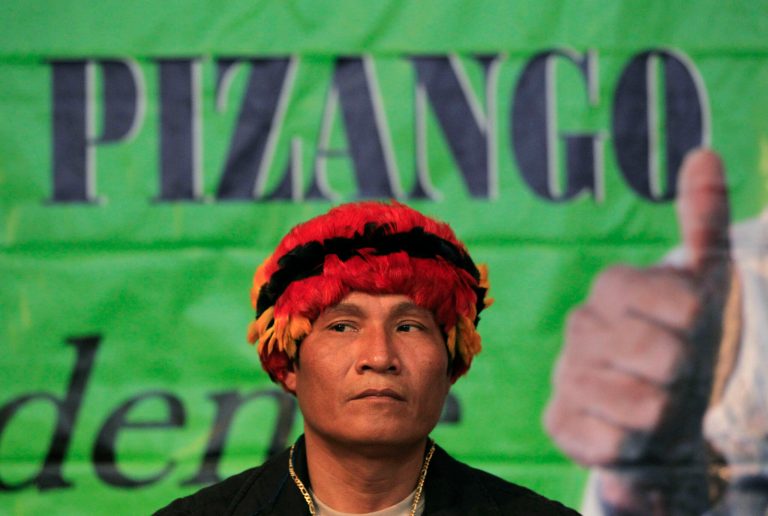 FILE - In this Nov. 18, 2010, file photo, Peru's Amazon leader Alberto Pizango looks on during an act after announcing his candidacy for Peru's 2011 presidential elections in Lima, Peru. Pizango and 52 others went on trial Wednesday in the killing of a dozen police officers after security forces fired on protesters opposed to plans to open the Amazon to widespread logging and oil drilling. (AP Photo/Martin Mejia, File)