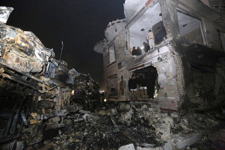 Civilians search for survivors in the rubble at the scene of a car bomb attack near the city of Hilla, Iraq, Thursday, Nov. 24, 2016. (AP Photo/Hadi Mizban)