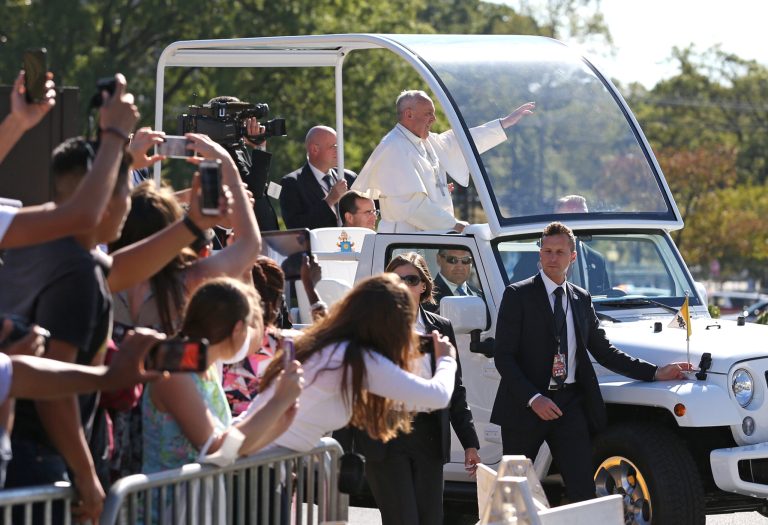 Pope Francis arrives in the popemobile at the Basilica of the National Shrine of the Immaculate Conception in Washington, Wednesday, Sept. 23, 2015, to hold a Canonization Mass for Junipero Serra. (Doug Mills/New York Times via AP, Pool)