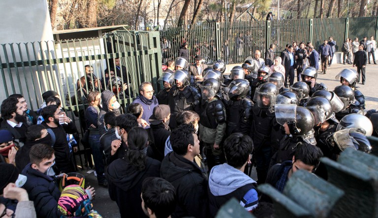 Iranian riot police prevent university students from joining other protesters over Iran weak economy, in Tehran, Iran, Saturday, Dec. 30, 2017. (AP Photo)
