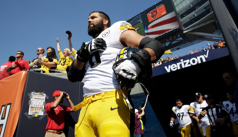 The hero here is Villaneuva, who served three tours in Afghanistan, then joined a football team, and doesn't care how his president disses him, or how his team turns their back on the president and their anthem. (AP Photo/Nam Y. Huh)