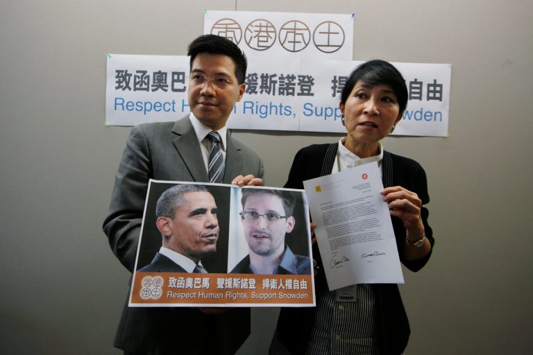 Pro-democractic legislators Claudia Mo Man-ching, right, and Gary Fan Kwok-wai said on Friday that they had written to President Obama to try to persuade him not to bring charges against the former US intelligence contractor Edward Snowden. (AP Photo/Kin Cheung)