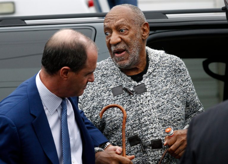 Comedian Bill Cosby is helped as he arrives for a court appearance in Elkins Park, Pa., Wednesday, Dec. 30, 2015. (AP Photo/Mel Evans)