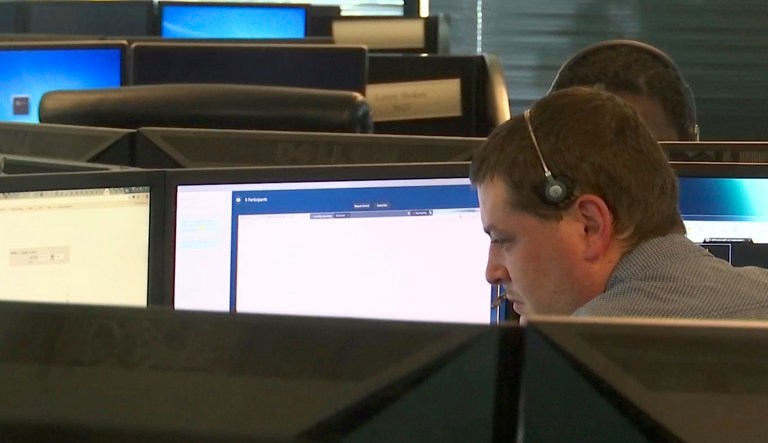 In this 2017 image made from video, seen though an interior window, employees work in the offices of Secureworks in Atlanta. A bipartisan coalition in Congress is working to tweak the 1986 Computer Fraud and Abuse Act, which bans access to computers without their owner's permission, so that companies that have been hacked can disrupt cyberattacks. (AP Photo/Marina Hutchinson)