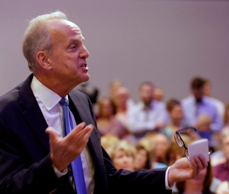 Sen. Jerry Moran, R-Kansas, addresses a crowd of several hundred during a town hall meeting Monday, June 12, 2017, in Lenexa, Kan. (AP Photo/Charlie Riedel)