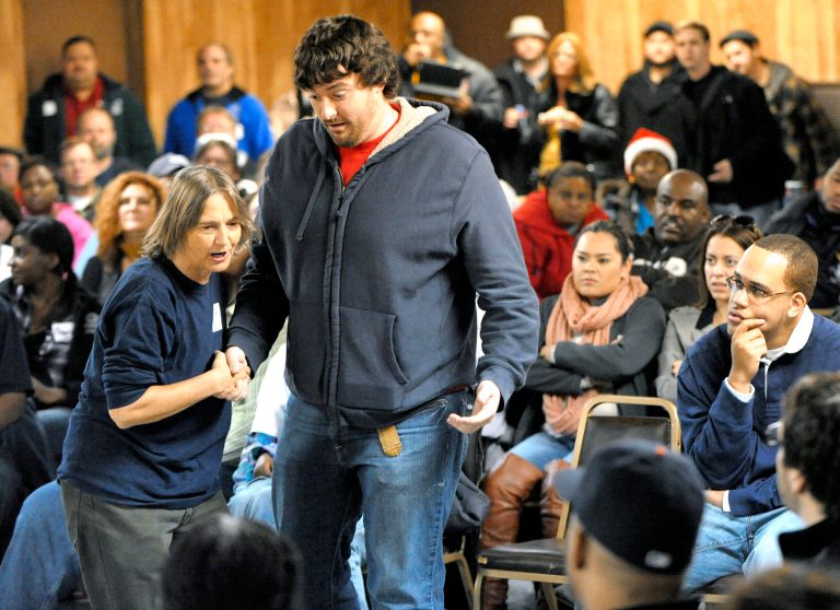   Community activist Lisa Fithian, left, teaches SEIU (Service Employees International Union) Healthcare Michigan member Frank Shaft, 26, of Lansing, and other attendees how to peacefully interact with police officers on Saturday, Dec. 8, 2012 at UAW Local 600 union hall in Dearborn, Mich. Republican lawmakers are putting the final touches on legislation that would allow workers to opt out of union dues at a business where employees are represented by a union. Gov. Rick Snyder says he will sign it into law. (AP Photo/Detroit News, Todd McInturf) DETROIT FREE PRESS OUT; HUFFINGTON POST OUT  
