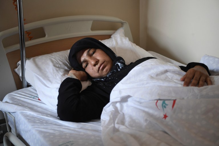 A Syrian woman rests in a hospital in Reyhanli, Turkey, Friday, April 7, 2017. Turkish media, quoting Turkey's Justice Minister Bekir Bozdag and other officials, says autopsy results show Syrians were subjected to chemical weapons attack in Idlib, Syria, on Tuesday.(AP Photo)