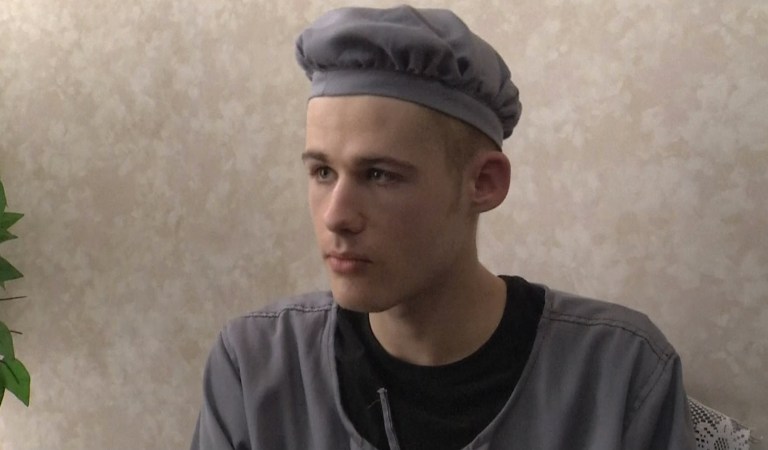 This image taken from video shows Matthew Miller in North Korea, Wednesday, Sept. 24, 2014. The American man recently sentenced by North Korea to six years of hard labor says he is digging in fields eight hours a day and being kept in isolation, but that so far his health isn't deteriorating. Under close guard and with only enough time to respond to one question, 24-year-old Matthew Miller spoke briefly to an Associated Press Video journalist at a Pyongyang hotel, where he had been brought to make a phone call to his family.  (AP Photo/AP Video)