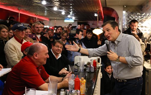 Presidential candidate Sen. Ted Cruz campaigns at Penny's Diner in Missouri Valley, Iowa. Now leading in Iowa, Cruz said that he's committed to visiting all 99 counties in the state. (AP Photo/Nati Harnik)