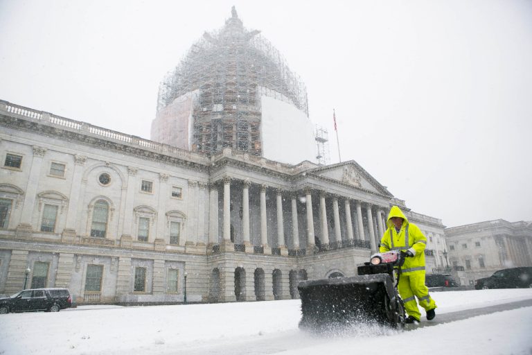 An Architect of the Capitol employee, plows snow outside the Capitol Building in Washington, Thursday, March 5, 2015. The U.S. federal government said its offices in the Washington area will be closed Thursday because of heavy snowfall expected in the region.
		(Graeme Jennings/Washington Examiner)