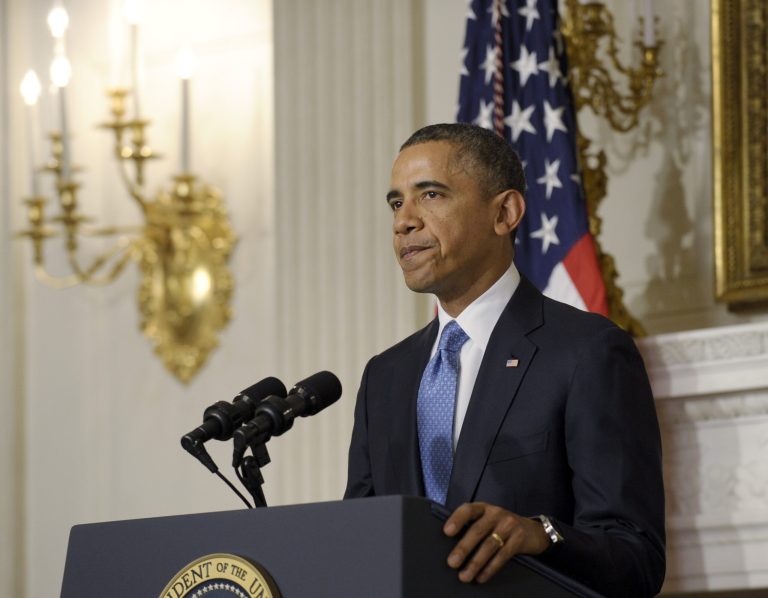 President Barack Obama pauses after concluding his statement on the historic agreement reached between six nations and Iran at an evening address in the State Dining Room at the White House in Washington, Saturday, Nov. 23, 2013. Obama said that the deal that has been struck calls on Iran to limit its nuclear activities in return for sanctions relief. (AP Photo/Susan Walsh)